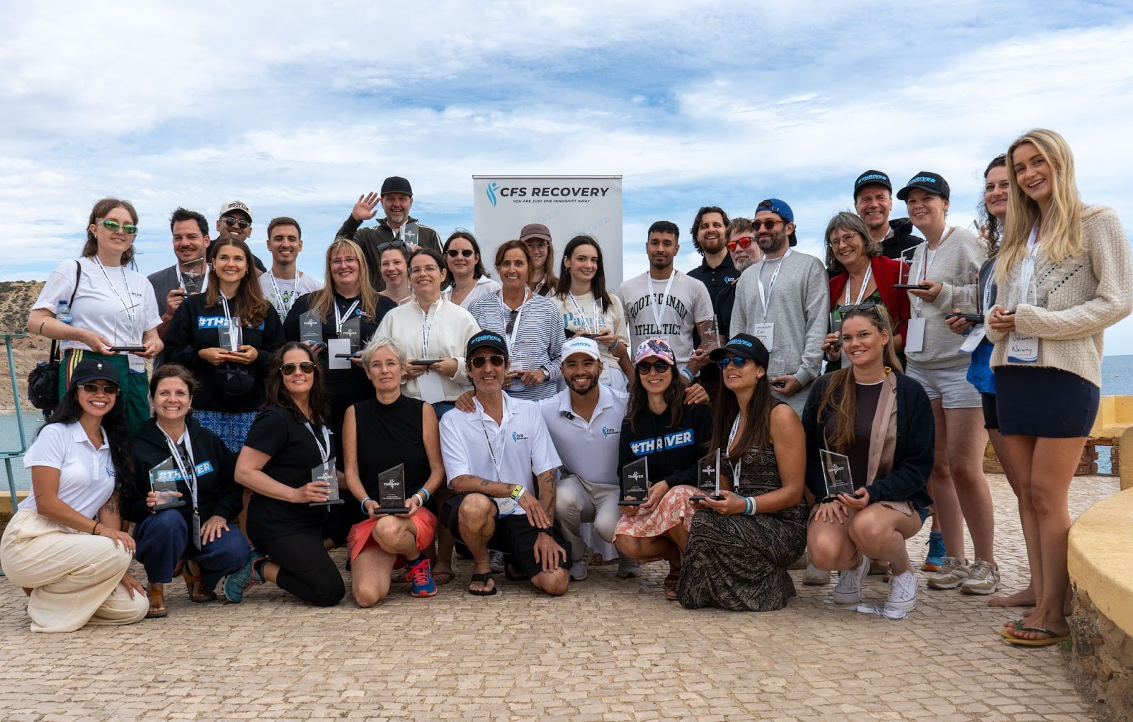 CFS Recovery Thrivers celebrating together with their trophies in Portugal
